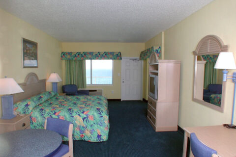 Beachside standard king motel room interior window view